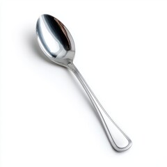 A single, shiny silver spoon resting elegantly on a surface. The spoon reflects light