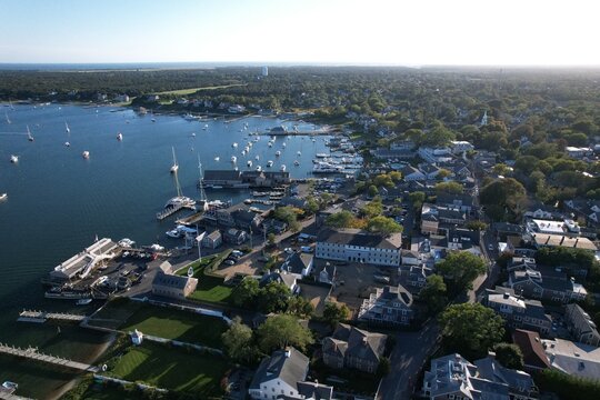 Aerial view of a coastal town with harbor and boats