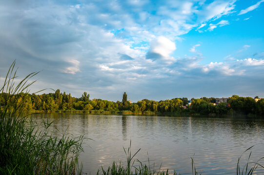 lake at the sunset. the evening sun is shining in the water.