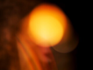 Colorful light leaks on black background for design and special effects. Retro film look. Abstract colorful light beams.