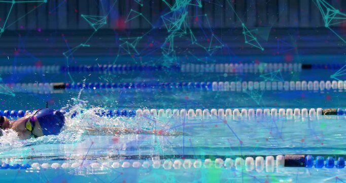 Female swimmer entering pool lane and initiating freestyle strokes under sports tech overlay