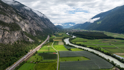 Aerial view of the Inn valley in Tyrol, Austria, near Haiming, showing the highway, railway, agricultural fields, and the Inn river © danr13