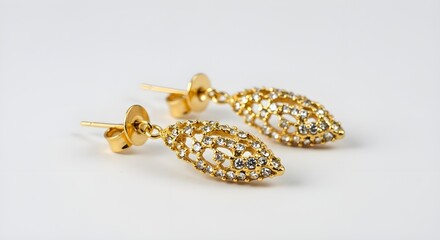 Golden ear rings on white background.