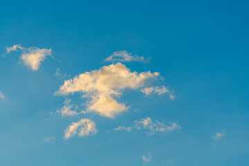 Isolated Cloud Illuminated by Sunset Light