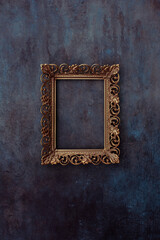 Golden metal frame mockup on a wall