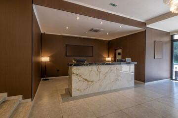 Marble reception desk in hotel lobby