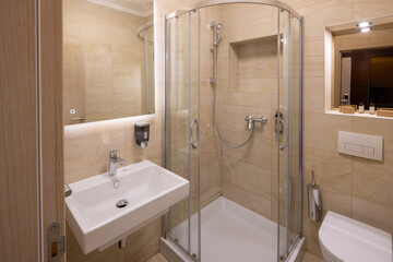 Interior of a hotel bathroom with a  mirror