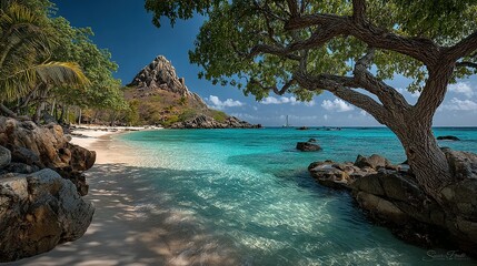 Tropical beach scene with turquoise water a mountain and lush vegetation.