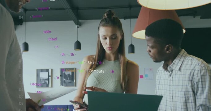 Team reviewing cybersecurity layout on laptop with printouts sparking HTML overlay refining design
