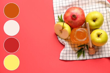 Jar of honey, pomegranate and apples for Rosh Hashanah celebration (Jewish New Year) on red background