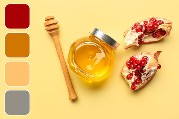 Jar of honey and pomegranate for Rosh Hashanah celebration (Jewish New Year) on yellow background