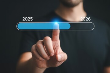 A person pointing at a progress bar showing the transition from 2025 to 2026 on a dark background