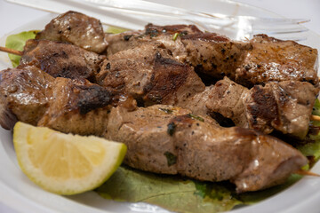 Catch of the day, tuna fish grilled on skewers on daily fish market in Marsala, Sicily, tasty street food in Italy