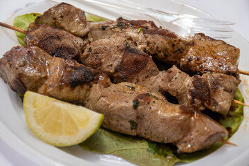 Catch of the day, tuna fish grilled on skewers on daily fish market in Marsala, Sicily, tasty street food in Italy