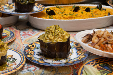 Delicious fresh cooked street food on daily food market in Palermo, Sicily, travel destination, food tourism Italy, variety of roasted, grilled fish, seafood, meat, vegetables served snacks, dish