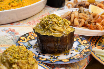 Delicious fresh cooked street food on daily food market in Palermo, Sicily, travel destination, food tourism Italy, variety of roasted, grilled fish, seafood, meat, vegetables served snacks, dish