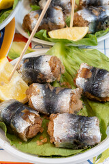 Delicious fresh cooked street food on daily food market in Palermo, Sicily, travel destination, food tourism Italy, variety of roasted, grilled fish, seafood, meat, vegetables served snacks, dish