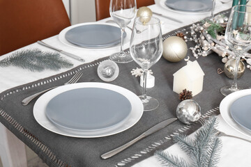 Dining table served for Christmas celebration, closeup