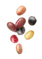 Different types of fresh potatoes falling on white background
