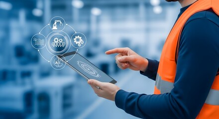automation, concept Industrial worker in safety vest using tablet with digital interface and industry 40 icons in a factory setting
