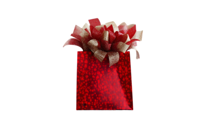 A shiny red gift bag with a large red and gold bow on top against a black background display image