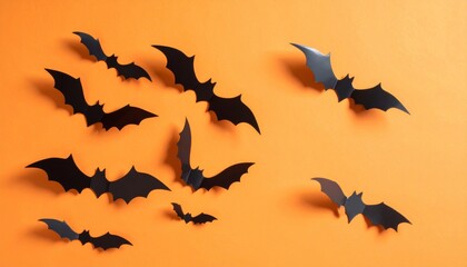 Naklejka premium halloween and decoration concept - paper bats flying