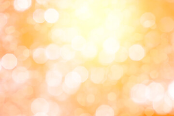 Obraz premium ボケた暖色の背景に光