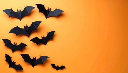 Naklejka premium halloween and decoration concept - paper bats flying
