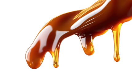 Close up shot of caramel sauce dripping down with a black background and glossy highlights