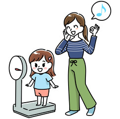 笑顔で体重を測る女の子と母親