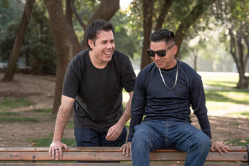 Two Men Laughing on a Park Bench, Outdoors