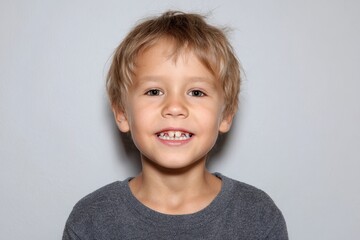 Adorable boy lacking several front teeth