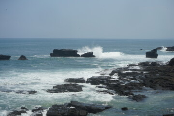waves crashing on rocks
