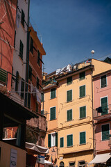 Vibrant photos of Cinque Terre featuring Italian beaches, boats on the Mediterranean, bikini lifestyle, coastal towns, colorful villages, and summer vacations