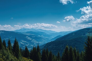 Fototapeta premium Scenic hills under a clear blue sky with forested areas