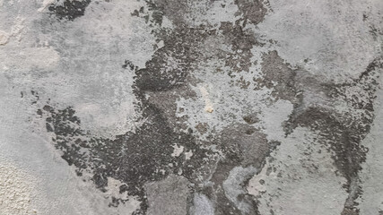 Detailed cement wall with old and stained surface, featuring natural wear and tear. Grunge texture ideal for architectural backgrounds, aged design concepts, and restoration references.