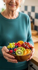 Obraz premium Senior Woman Holding Bowl of Fresh Fruit for Healthy Aging Lifestyle