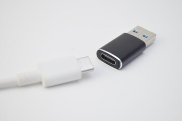 Fototapeta premium Close up USB Type-C cable with USB adapter, modern technology connector for charging and data transfer devices.