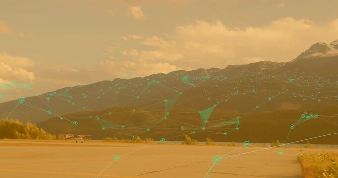 Engine starting pulsing network graphics, plane taxiing then lifting off runway toward mountains