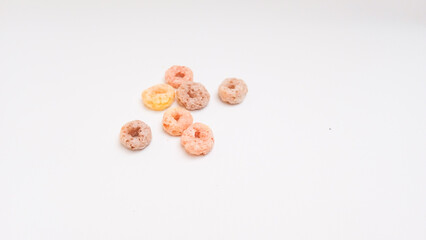 Colorful cereal rings isolated on white background. Copy space