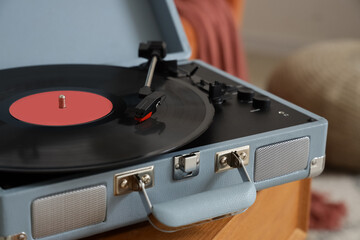 Record player on table in room, closeup