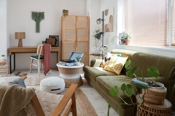 Interior of living room with record player on table and sofa