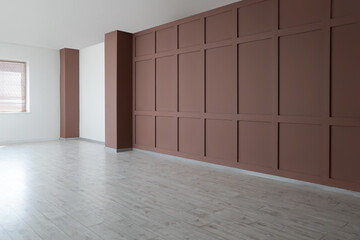 Empty spacious room with brown wall