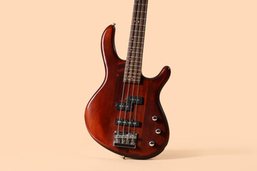Fototapeta premium Brown electric guitar on beige background