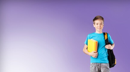 Happy young school student standing on background