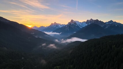 majestic mountain peaks bathed in golden sunrise light - Powered by Adobe