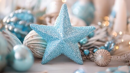 Close-up of a light blue glittery star surrounded by Christmas ornaments and decorations in soft, muted tones.