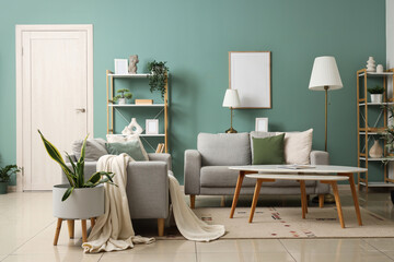 Interior of stylish living room with lamps, grey sofas and shelf units
