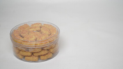 A close-up photo of traditional Indonesian cheese cookies (kastengel) 