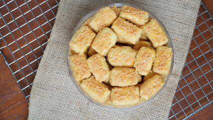 A close-up photo of traditional Indonesian cheese cookies (kastengel) 